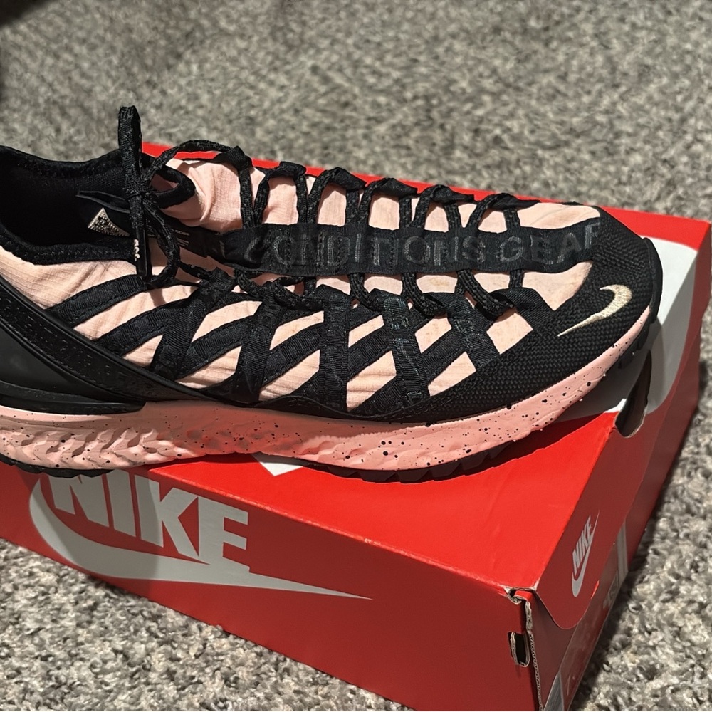 Nike Black and Pink Athletic Shoes with Woven Design